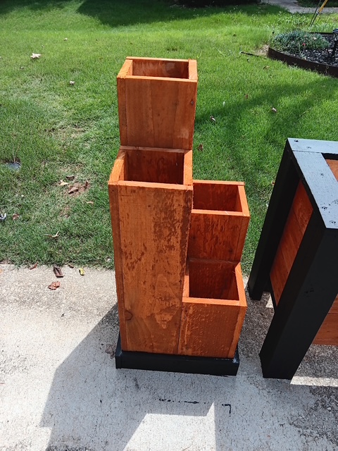 Tiered custom wooden plant stand with a warm stained finish